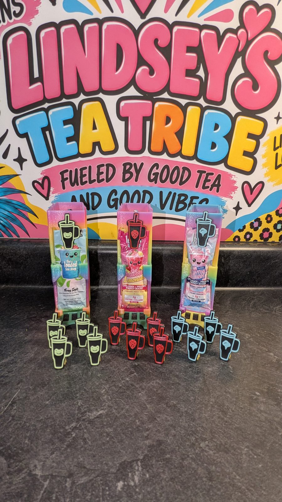 Green Frog, red Strawberry and light blue Cotton Candy cup-shaped clips displayed beside loaded tea holders